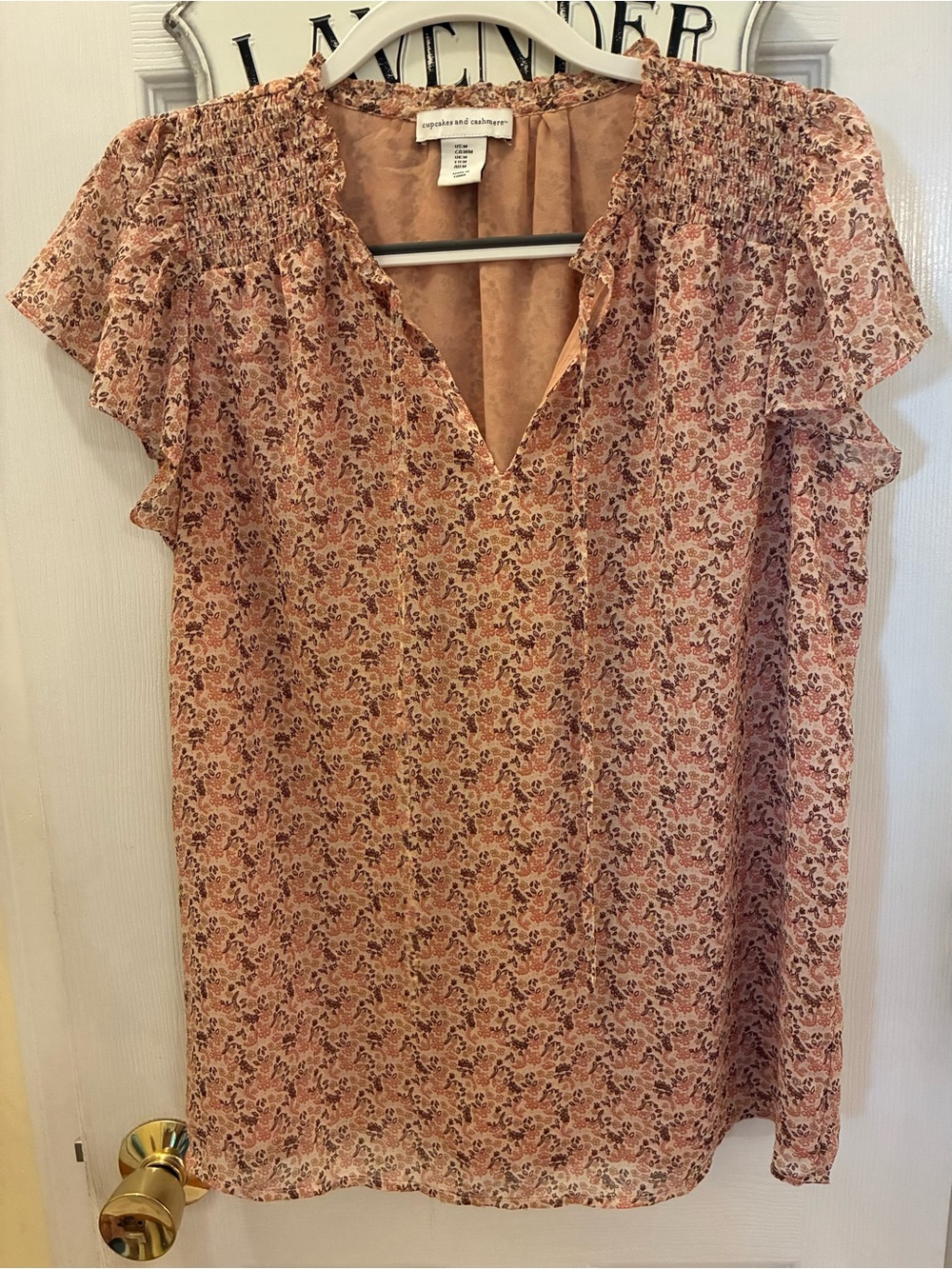cupcakes & cashmere Dusty Peach Floral Smocked Flutter Sleeve Top